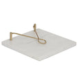 Marble and brass napkin holder with white stone base and gold arm for Hamptons style table decor