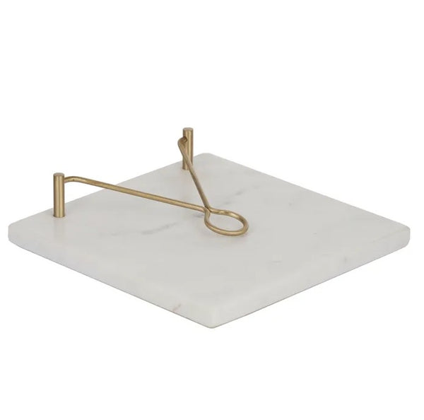 Marble and brass napkin holder with white stone base and gold arm for Hamptons style table decor