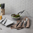 Marble serving bowl styled on a contemporary dining setting with salad servers, marble serving board and entertaining essentials on a kitchen benchtop