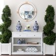 Marina Rattan Mirror styled above a white Nantucket hall table with blue and white ginger jars in a Hamptons-inspired entryway.