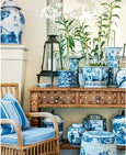 blue and white chinoiserie decor with ceramic vases and rattan chair styling from Beautiful by Mark D Sikes