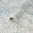 Folded Marlowe Porcelain Rug showing its plush 12mm multi-textured pile and distressed traditional pattern.