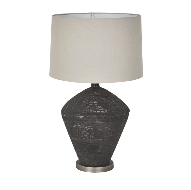Meridien black ceramic table lamp with natural linen shade styled in a contemporary living space