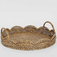 Angled view of the Mesa Scallop Rattan Tray showcasing its handcrafted woven rattan construction, scalloped edge and integrated handles.
