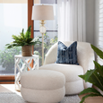 Mia Floor Lamp Antique Silver styled beside boucle armchair in a relaxed coastal interior
