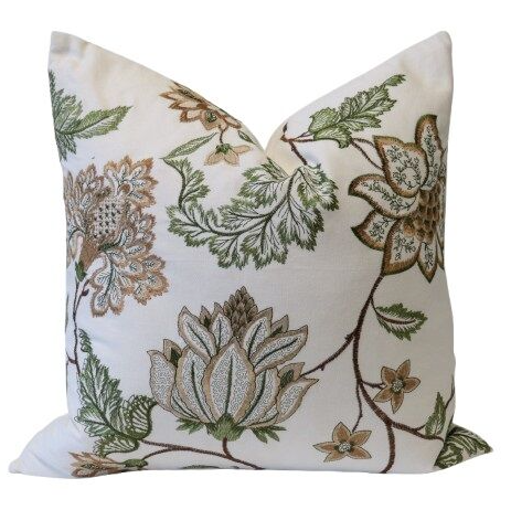 white cushion with olive botanical embroidery floral design front view