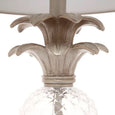 close up of antique silver pineapple crown detail on table lamp