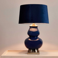 Elegant ceramic table lamp with midnight blue glaze in a contemporary living room