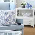 Ming Owl Ceramic 15cm Blue & White displayed on a Hamptons-style side table with orchids and coastal decor in a light-filled living room.