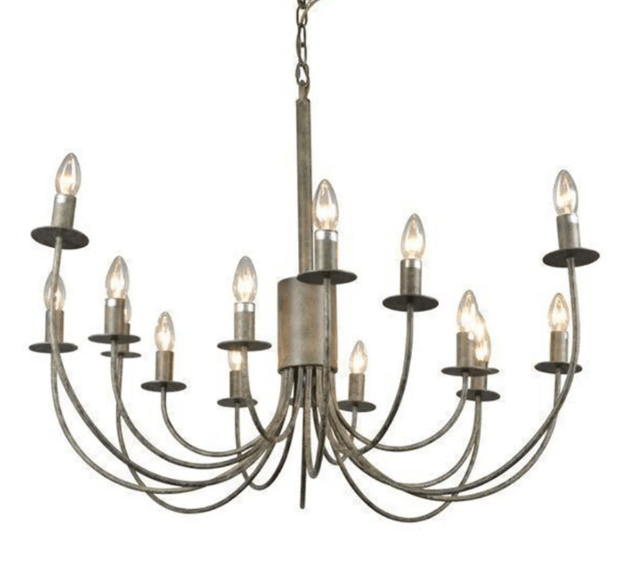 Modern iron chandelier with curved arm design hanging in a stylish entryway with warm ambient lighting