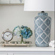 Decorative geometric ceramic table lamp in Hamptons style interior with soft ambient lighting
