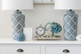 Decorative geometric ceramic table lamp in Hamptons style interior with soft ambient lighting
