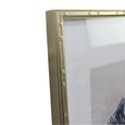 Navy and gold-toned scallop shell print in a gold-toned bamboo-look frame with pale surround — supplier image 3