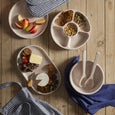 navy tea towel styled with serving boards and tableware overhead kitchen styling