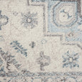 Detailed close-up of the Newport Blue Runner featuring vintage-inspired medallion motifs in muted blue and ivory
