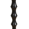 Handcrafted black floor lamp with tall rhythmic base and linen shade.