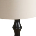 Modern floor lamp 156cm high with dark sculptural base and round natural shade.