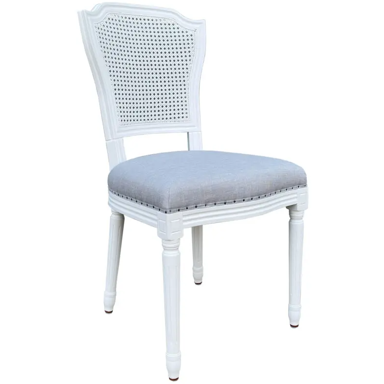 Olivia White Dining Chair featuring a satin white solid oak frame, handwoven rattan back and duck egg linen upholstered seat.