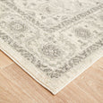 Close-up of the Parker White Rug highlighting the distressed floral border and textured pile