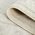 Parker Winter White Runner Rug folded back to show the durable woven backing and finished edge.