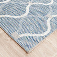 Corner detail of the Patio Rug Blue highlighting the flatwoven construction and coastal-inspired pattern