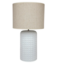 Patronga table lamp featuring a woven rattan-look ceramic base with chalky matte finish and natural linen-look drum shade.