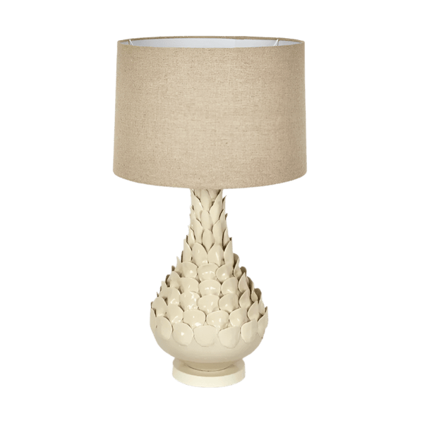 Petal ceramic table lamp with natural linen shade styled on a bedside table in a modern coastal interior