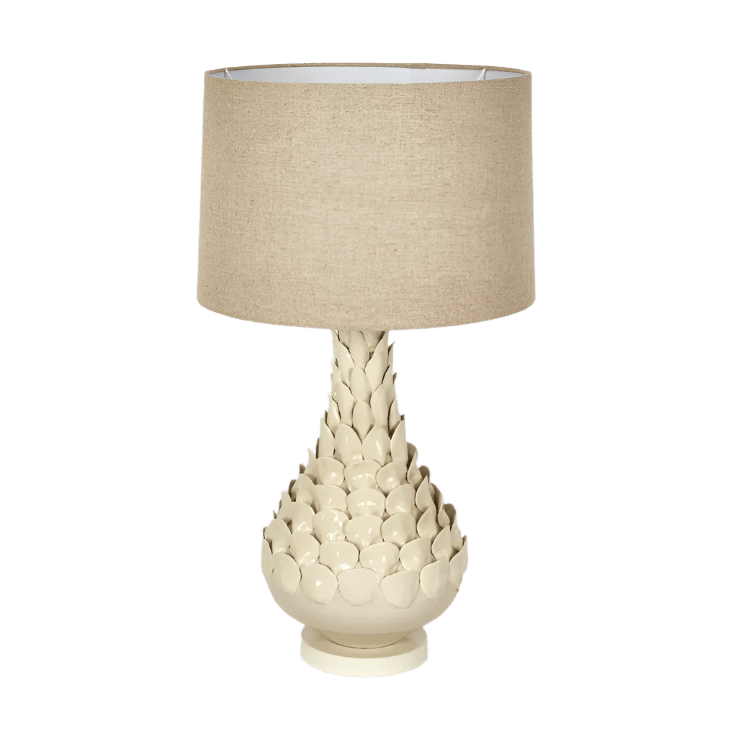 Petal ceramic table lamp with natural linen shade styled on a bedside table in a modern coastal interior