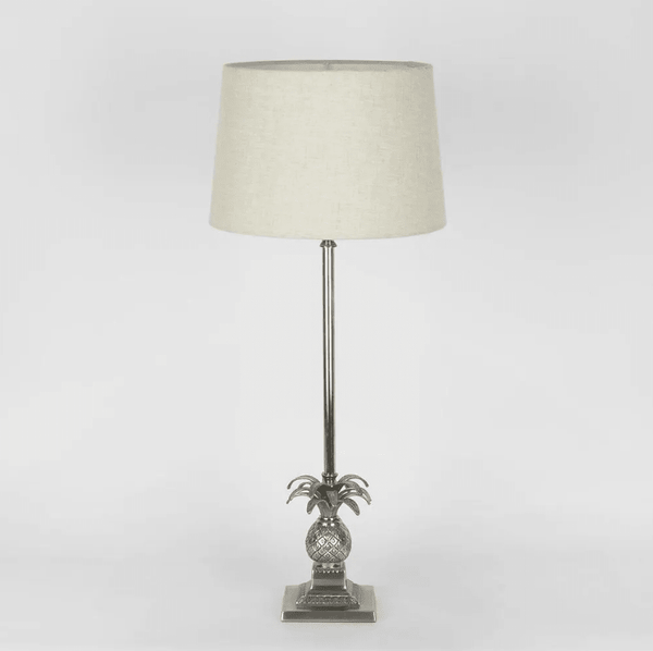 Pineapple table lamp with detailed base and spiked leaves in Hamptons style interior