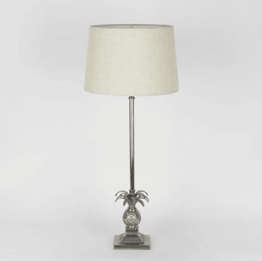 Pineapple table lamp with detailed base and spiked leaves in Hamptons style interior