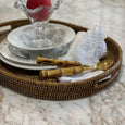 Plantation Oval Small woven tray styled with white tableware, linen napkin and bamboo-handled cutlery.