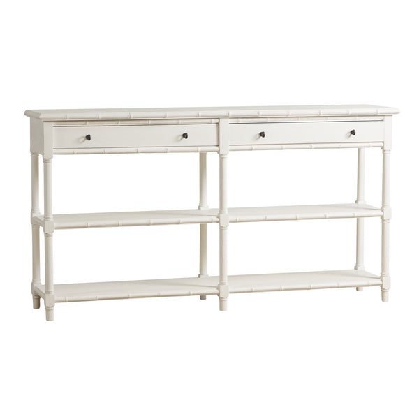 White Portico Console with bamboo-inspired accents, two drawers with brass pulls, and two lower shelves in an elegant coastal style design.