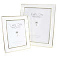 White and gold enamel photo frames in two sizes featuring slim metallic trim and timeless contemporary styling.