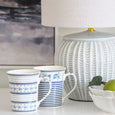 Portsea soft blue ceramic table lamp styled with blue and white mugs in a coastal Hamptons setting