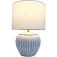 Portsea white ceramic table lamp illuminated with neutral linen shade for soft ambient lighting
