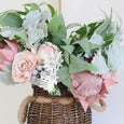 Protea Rose Dusty Miller Mix Bouquet 40cm Pink styled in woven basket vase on coastal console table