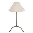 Provence iron table lamp with bronze hand-beaten base and natural linen shade styled on bedside table