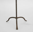 Bronze iron table lamp with linen shade in French country style, featuring a hand-beaten base and conical shade.