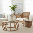 Side view of Havana occasional chair featuring woven rattan frame and cream seat cushion