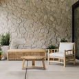 Natural rattan storage bench with cushion styled in coastal hallway with woven basket and neutral decor