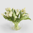 White Real Touch tulip arrangement with realistic green leaves and faux water in rounded glass vase