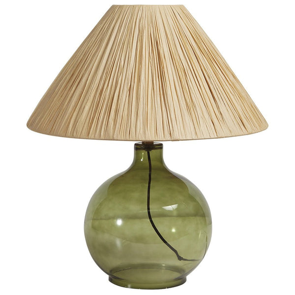 Rio Lamp styled on a bedside table with a transparent green base and textured paper shade.

