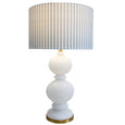 Elegant Hamptons-inspired Riviera Lamp creating warm ambient lighting in a coastal living room
