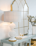 75cm Riviera table lamp featuring white glass base with iron accents and blue white linen shade
