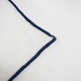 Close-up of Riviera Tablecloth White Navy showing embroidered navy edge detailing on white cotton fabric