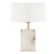 Roco alabaster table lamp with brass-finished frame and frosted white shade styled in a luxury living room
