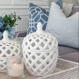 San Diego Ocean Cushions styled with blue ticking stripe cushions, hydrangeas and white ceramics in a Hamptons living room.