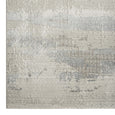 Corner detail of the Sandbar Mist Rug highlighting the abstract pattern, finely textured weave and genuine short fringe.