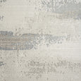Detailed close-up of the Sandbar Mist Rug featuring layered ivory, stone and mist grey textures with a luxurious soft finish.