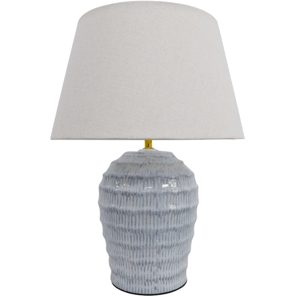 Seabrook Ridge ceramic table lamp with ribbed blue-grey base and linen shade styled in a coastal living room
